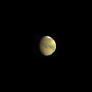 This is an image of Mars taken through the PTO's telescope. The planet is shown south up in the standard orientation provided by a Newtonian reflector telescope. Of course this view puts the bright white southern ice cap at the top. The rest of the planet is a rusty orange color with large areas of dark surface markings.
